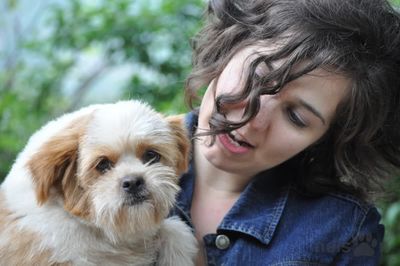 Woman holds fluffy dog