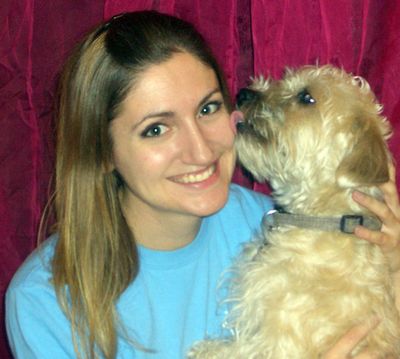 Dog licks woman's face